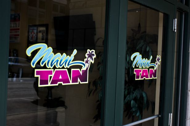 Maui Tan Arlington Heights.  Vibrant logo on store doors. 